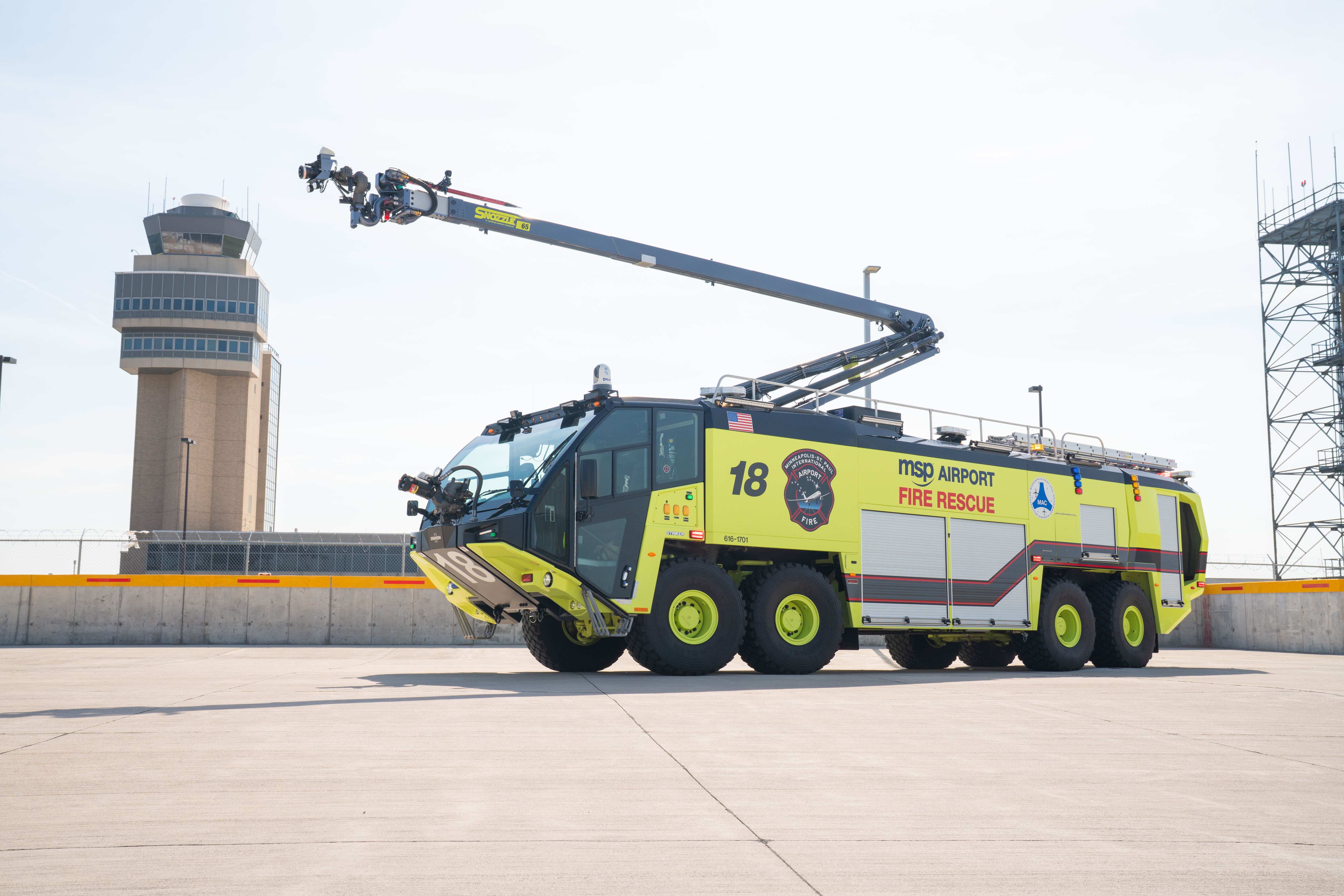 A Striker 8x8 ARFF parked outside on a sunny day.