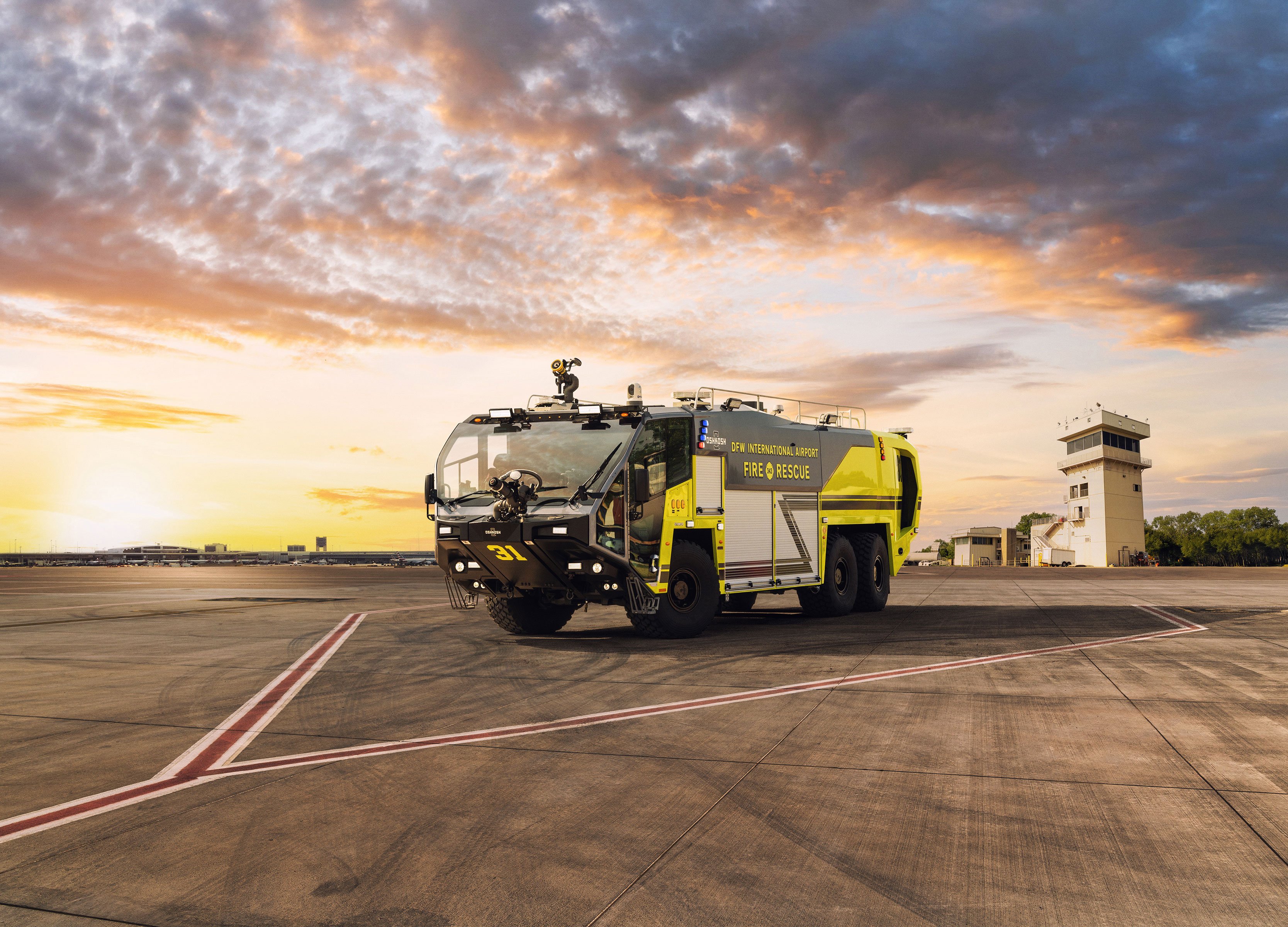 A Striker Volterra Electric ARFF parked outside at sunset.