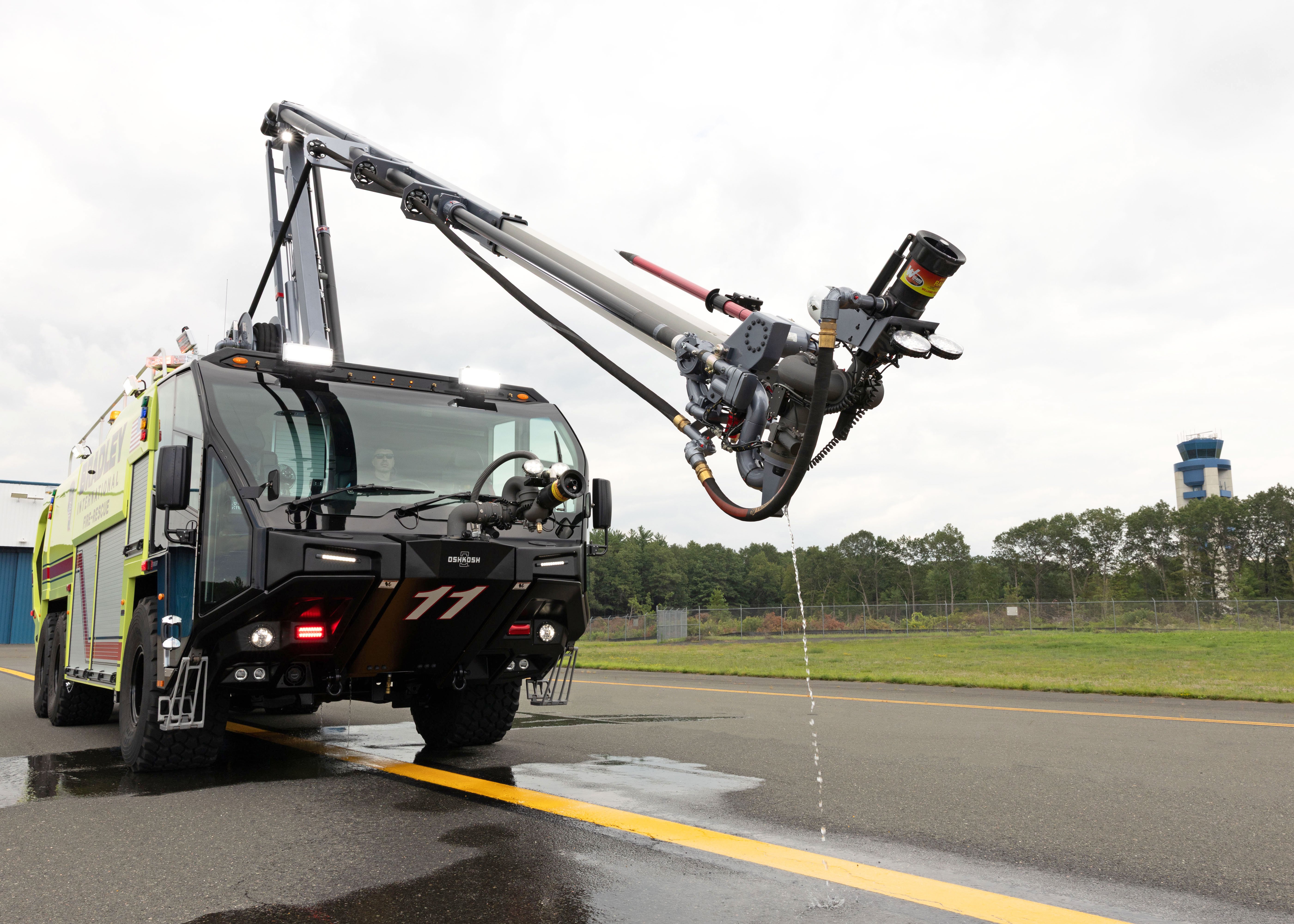 A Striker ARFF parked outside with the Snozzle high reach extendable turret extended.