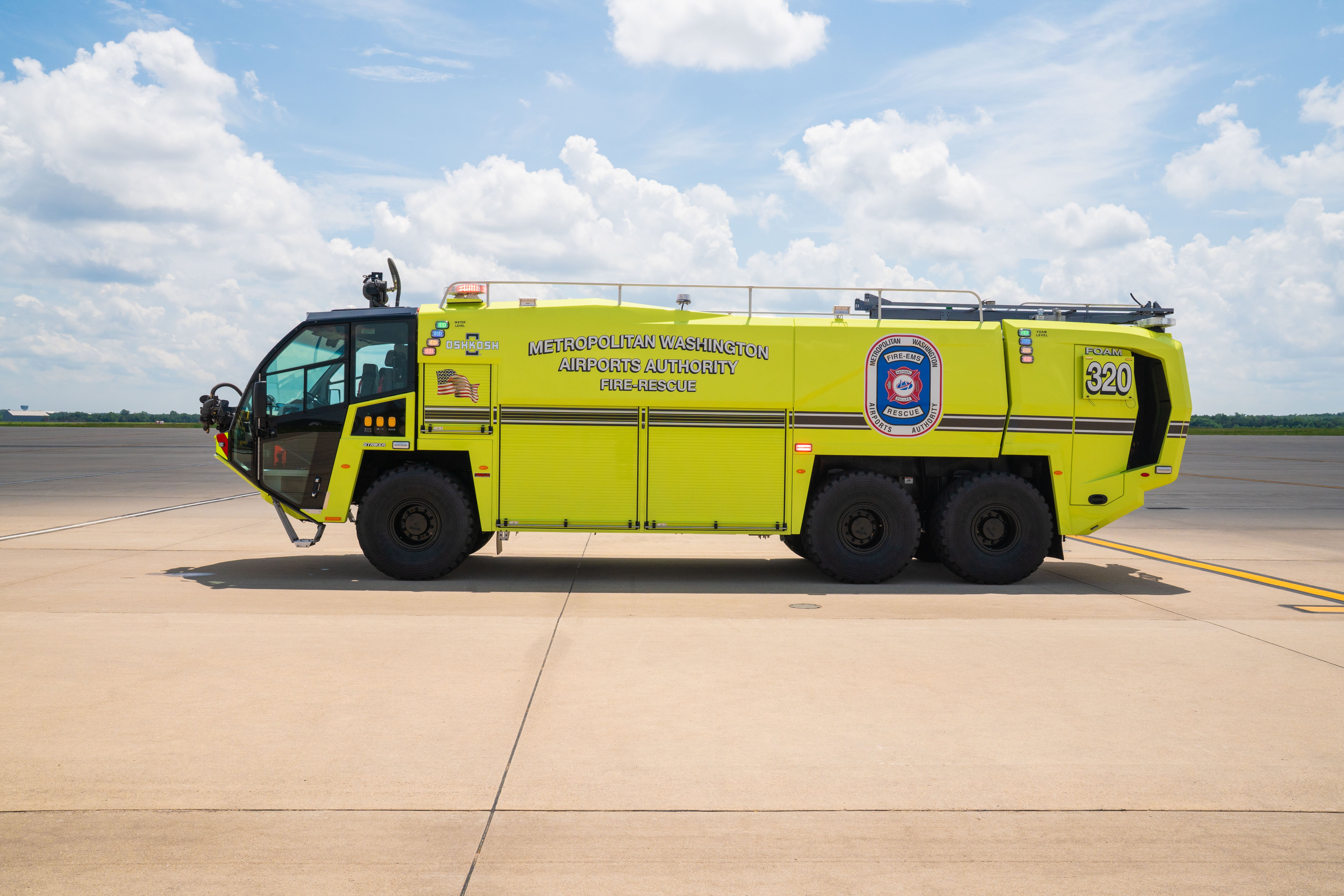 A Striker 6x6 ARFF parked outside on a cloudy day.