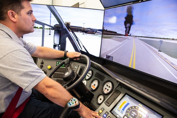 Man driving towards black smoke in an ARFF simulator