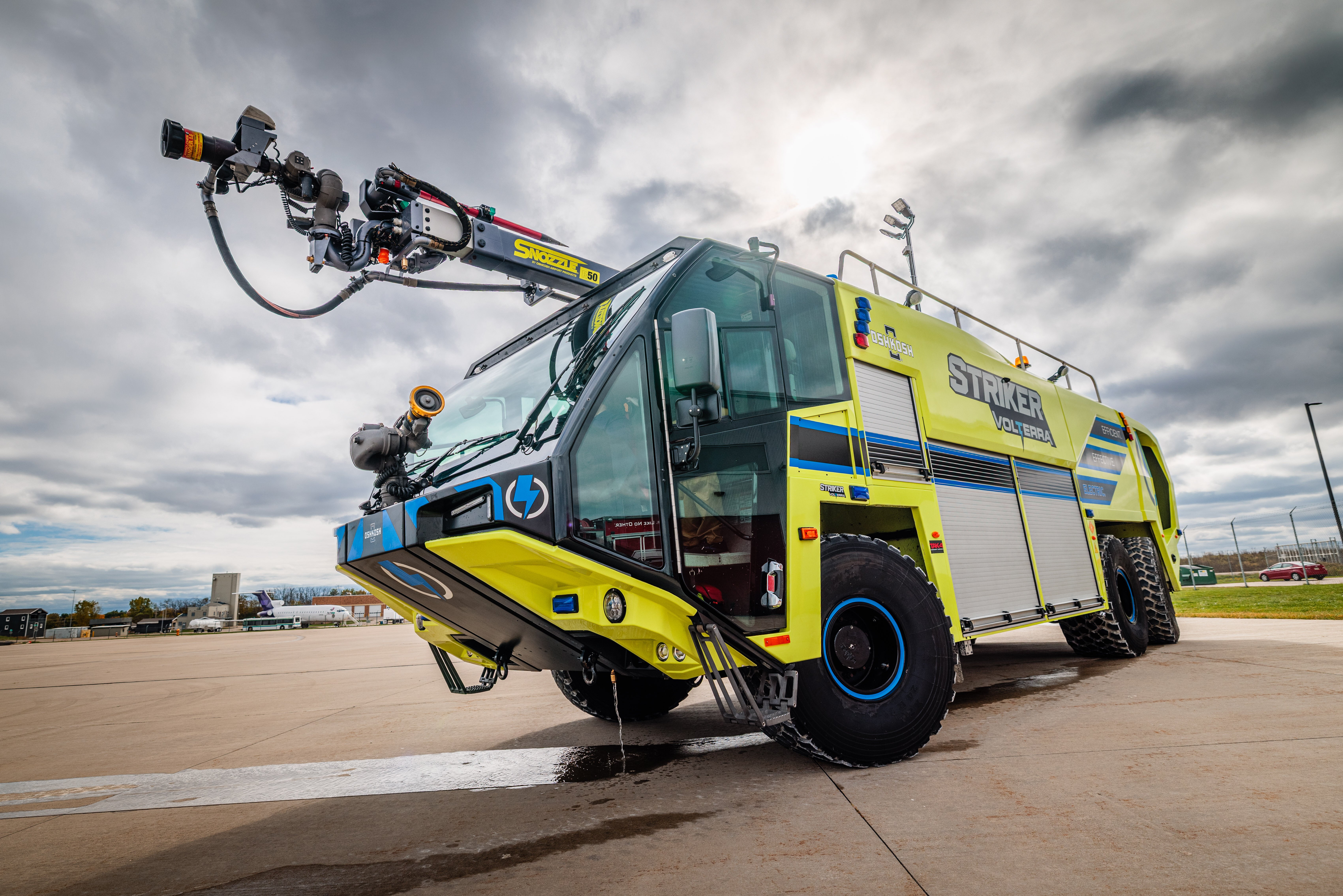 A Striker Volterra Electric ARFF parked outside on a cloudy day.