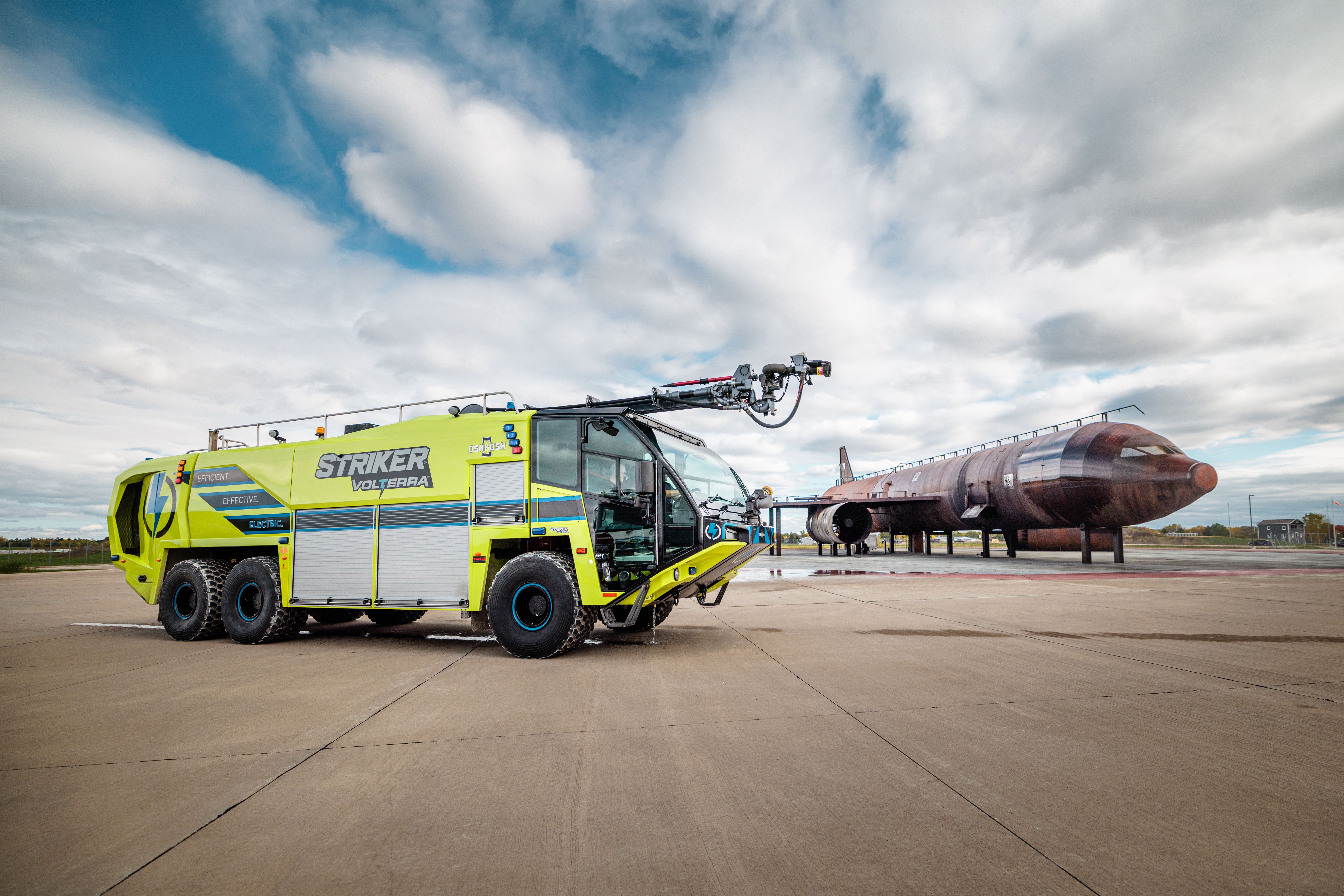 A Striker Volterra Electric ARFF parked outside on a cloudy day.