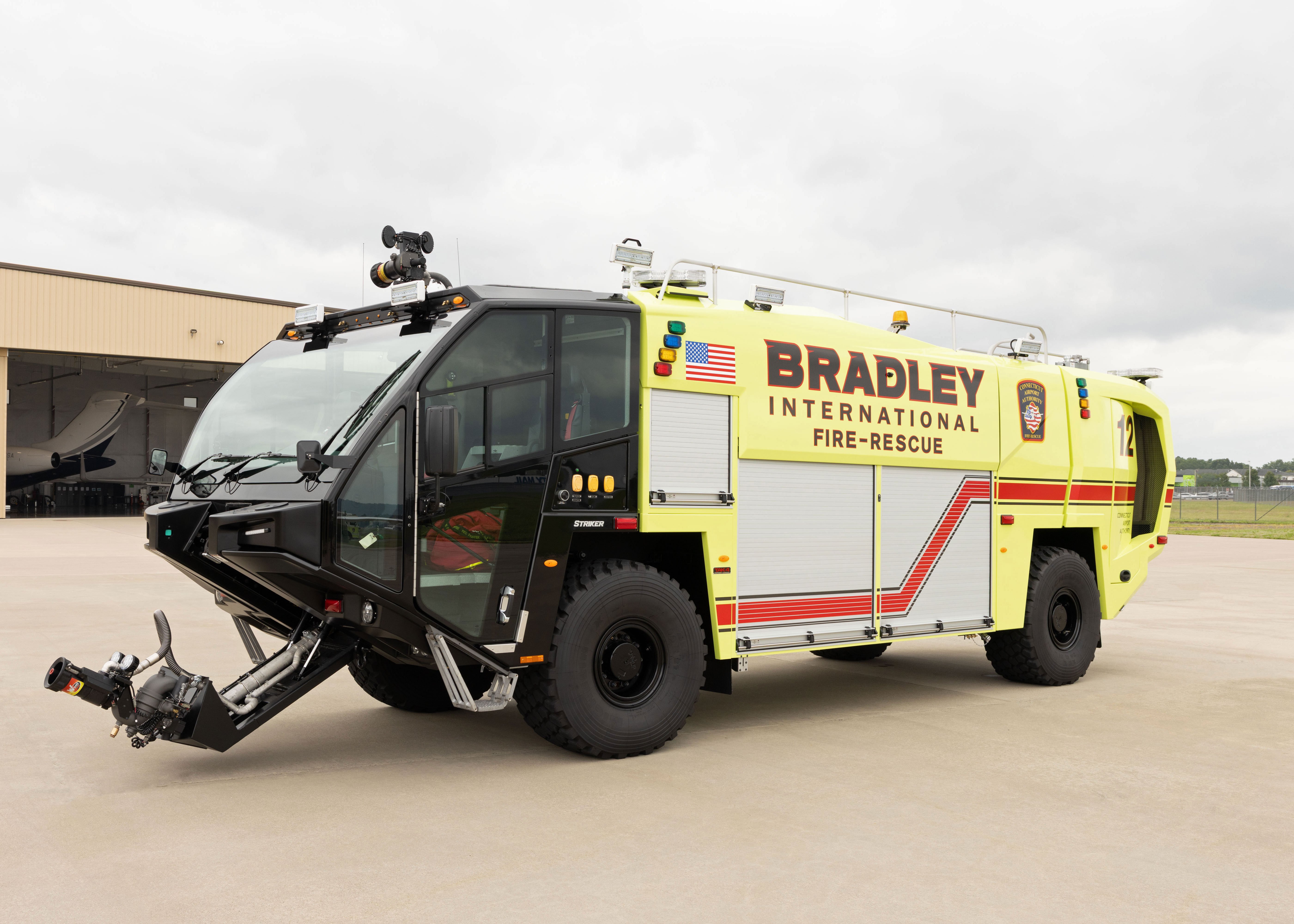 A Striker 4x4 ARFF parked outside on a cloudy day.