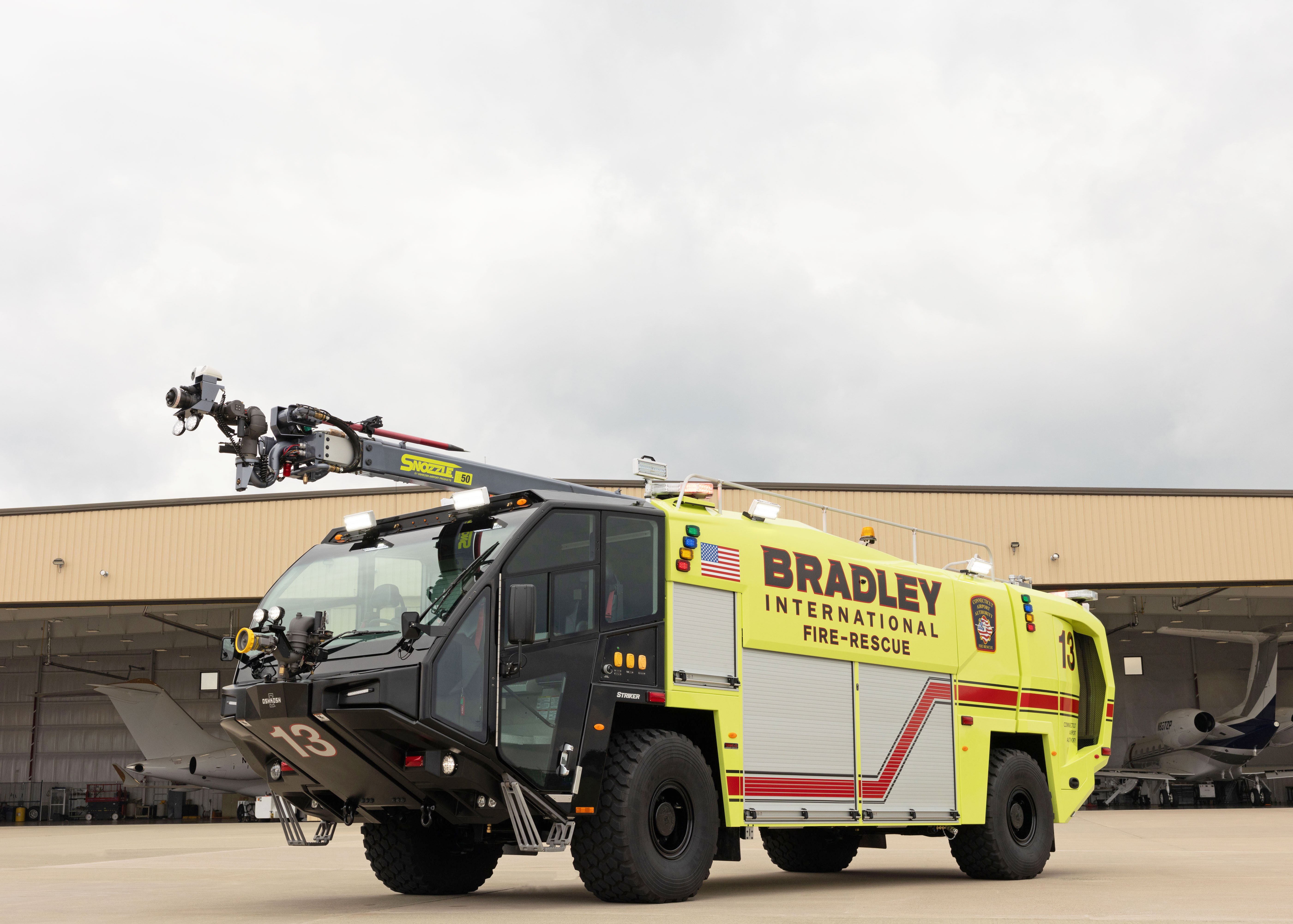 A Striker 4x4 ARFF parked outside on a cloudy day.