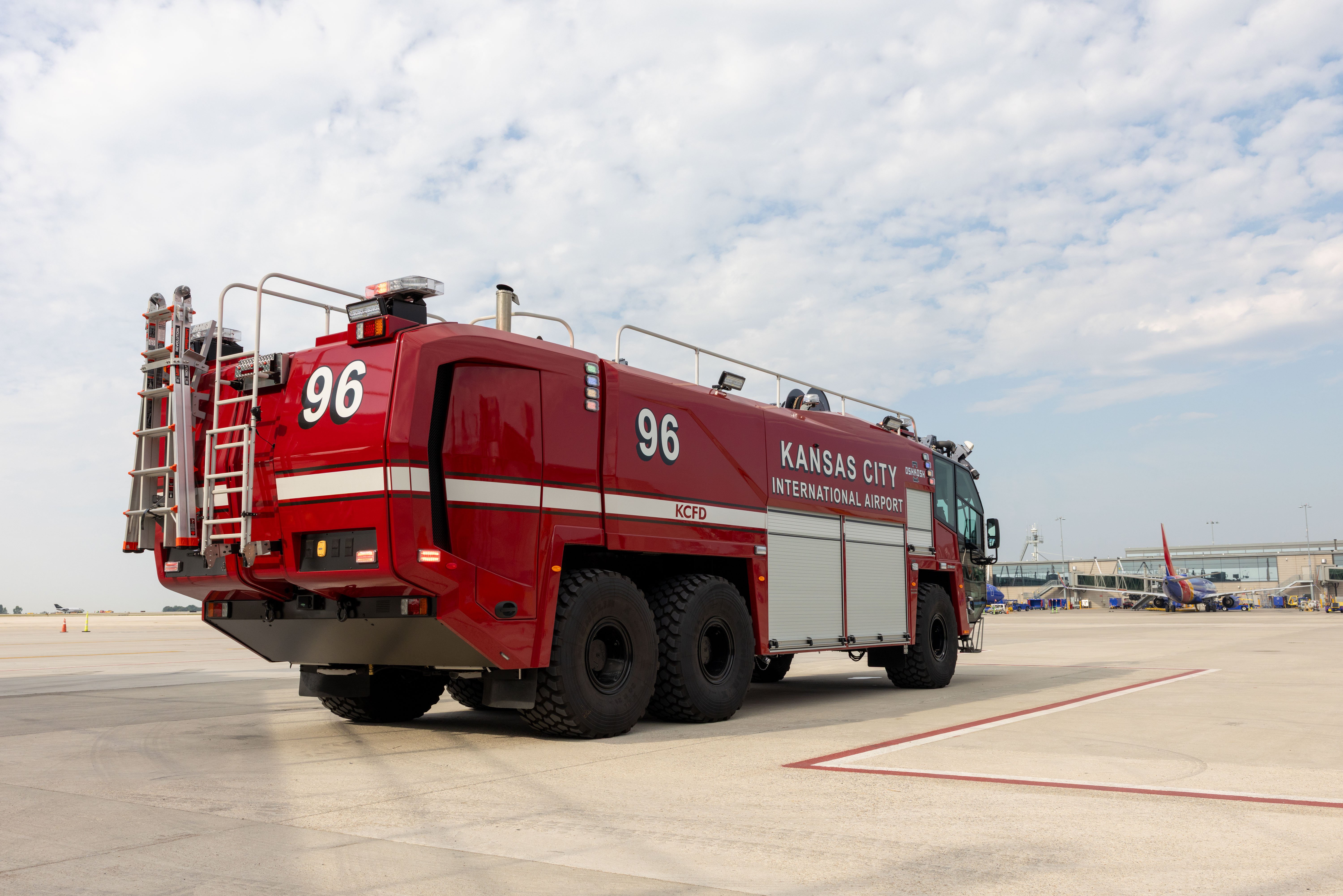 A Striker 6x6 ARFF parked outside on a cloudy day.