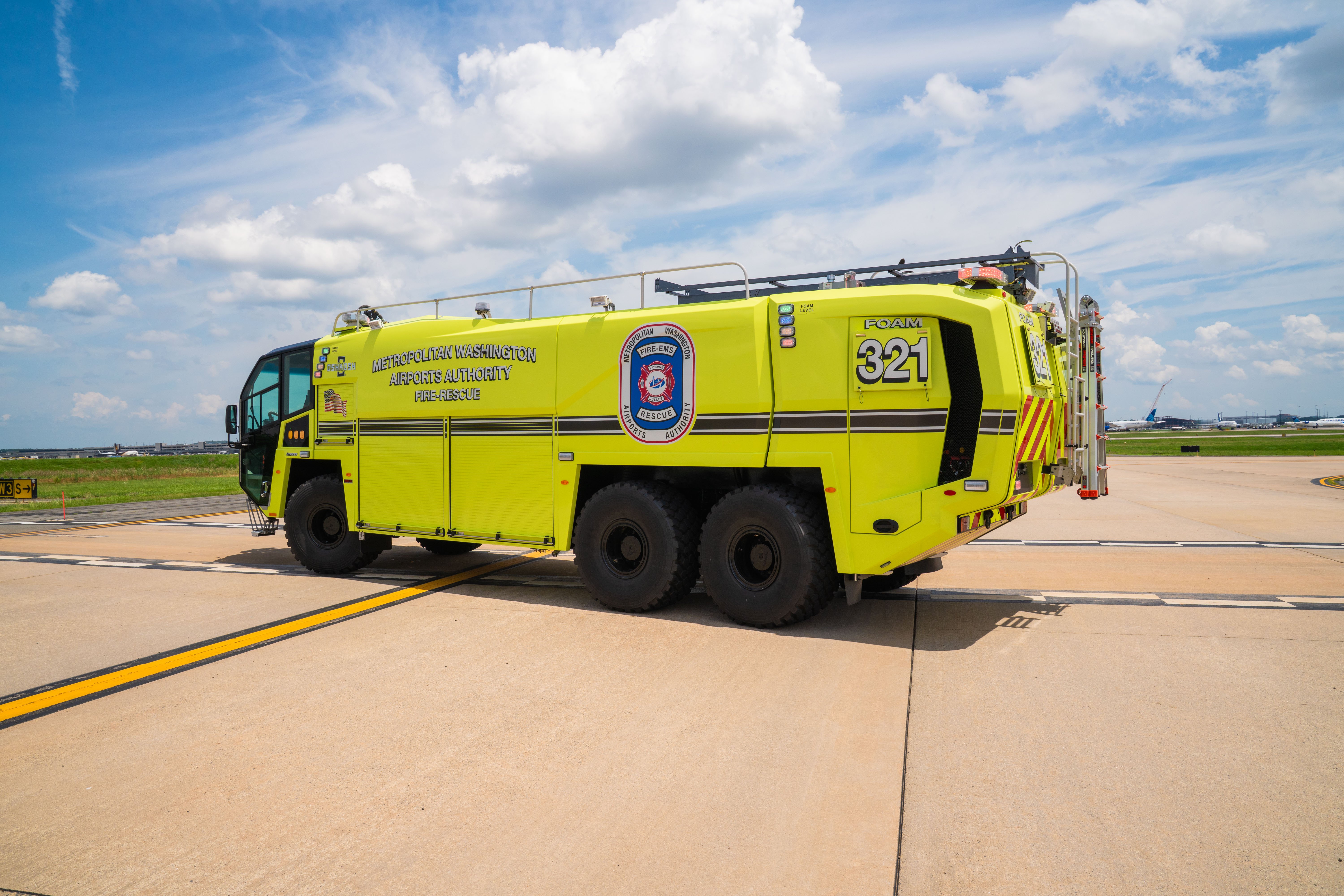 A Striker 6x6 ARFF parked outside on a cloudy day.