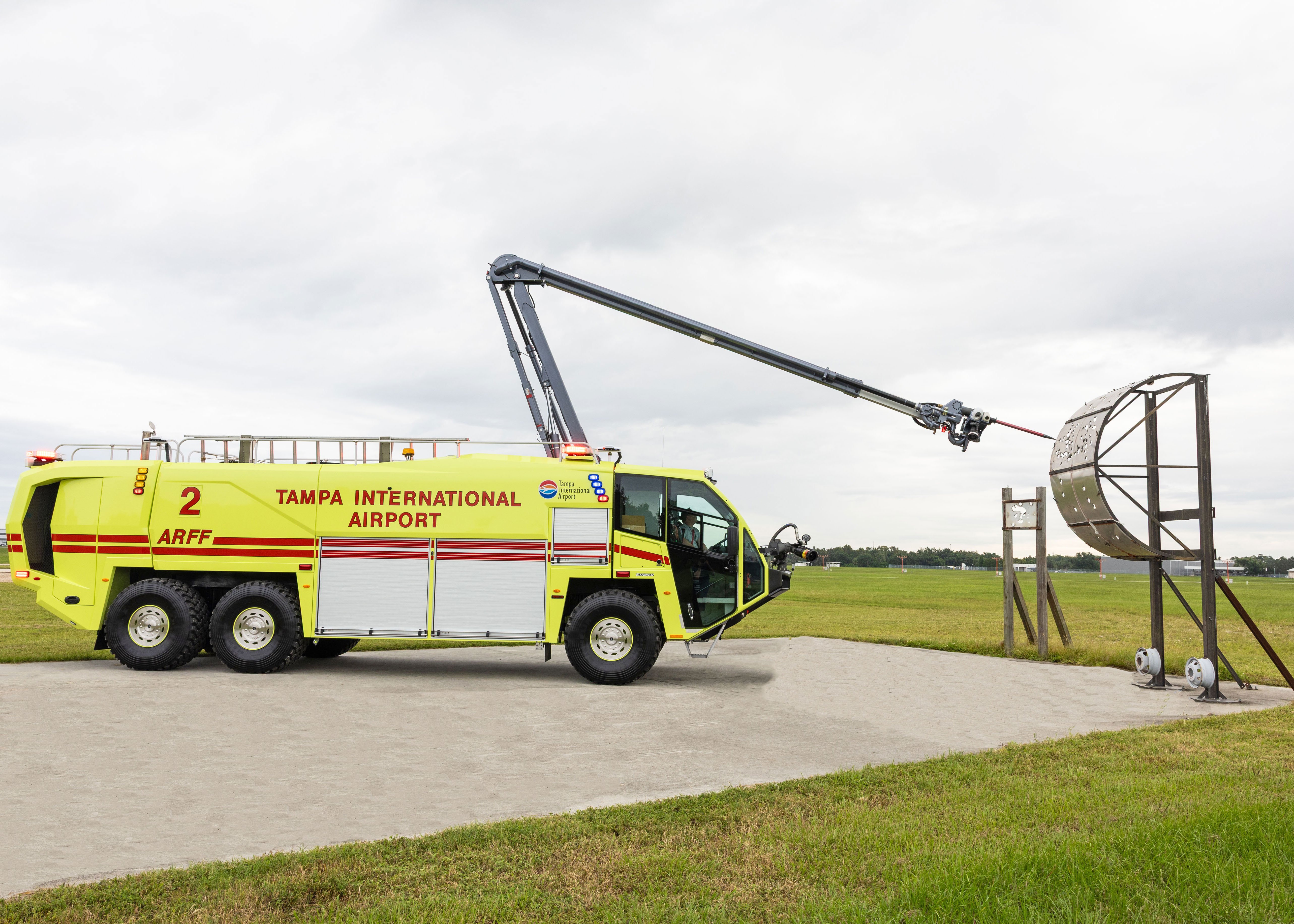 Striker 6x6 ARFF for Tampa International Airport parked outside with the Snozzle high reach extendable turret extended.