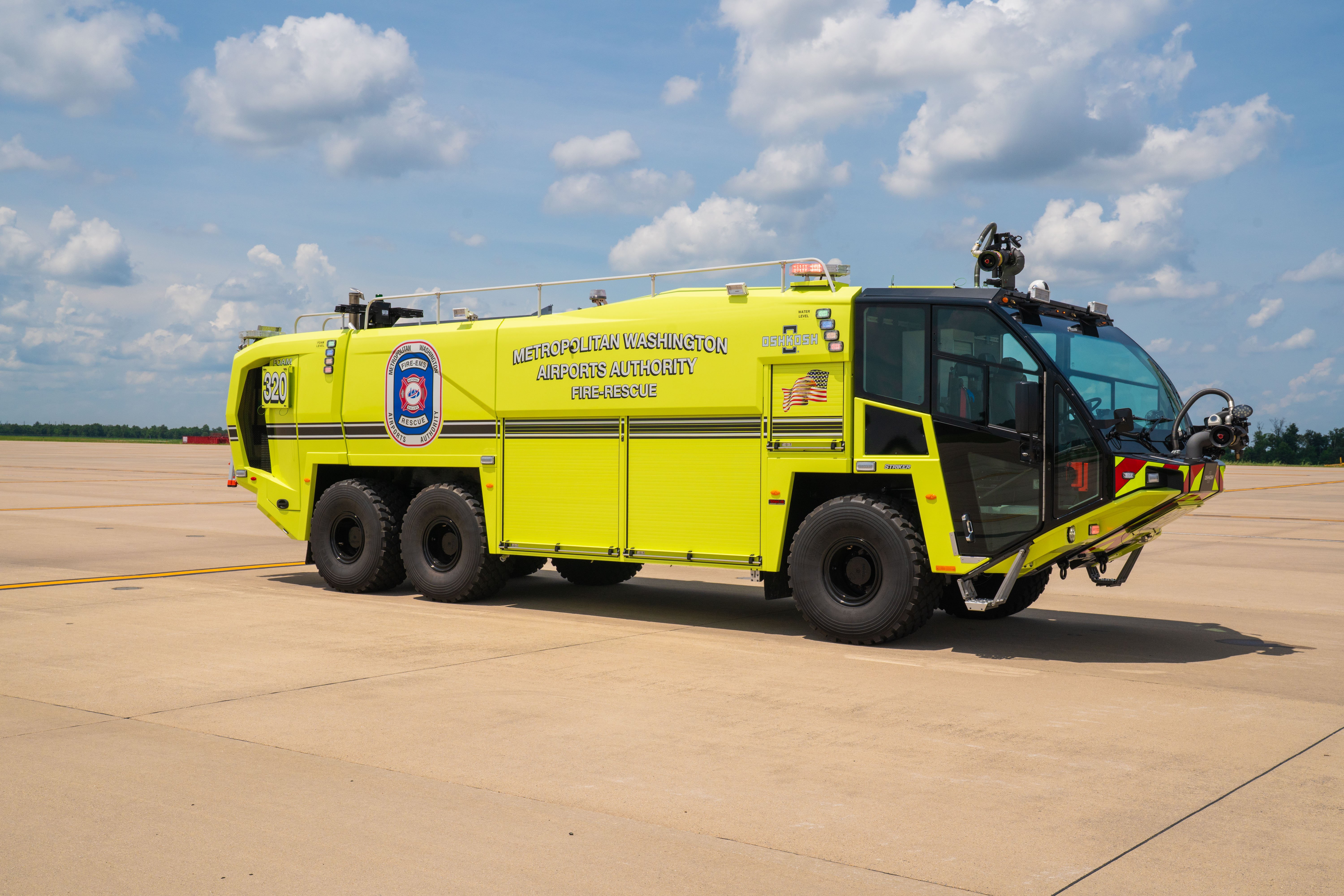 A Striker 6x6 ARFF parked outside on a cloudy day.