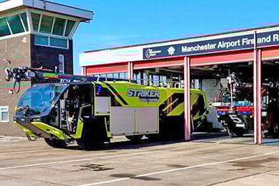 Striker Volterra electric ARFF with a Snozzle parked outside of the airport fire station at Manchester Airport.