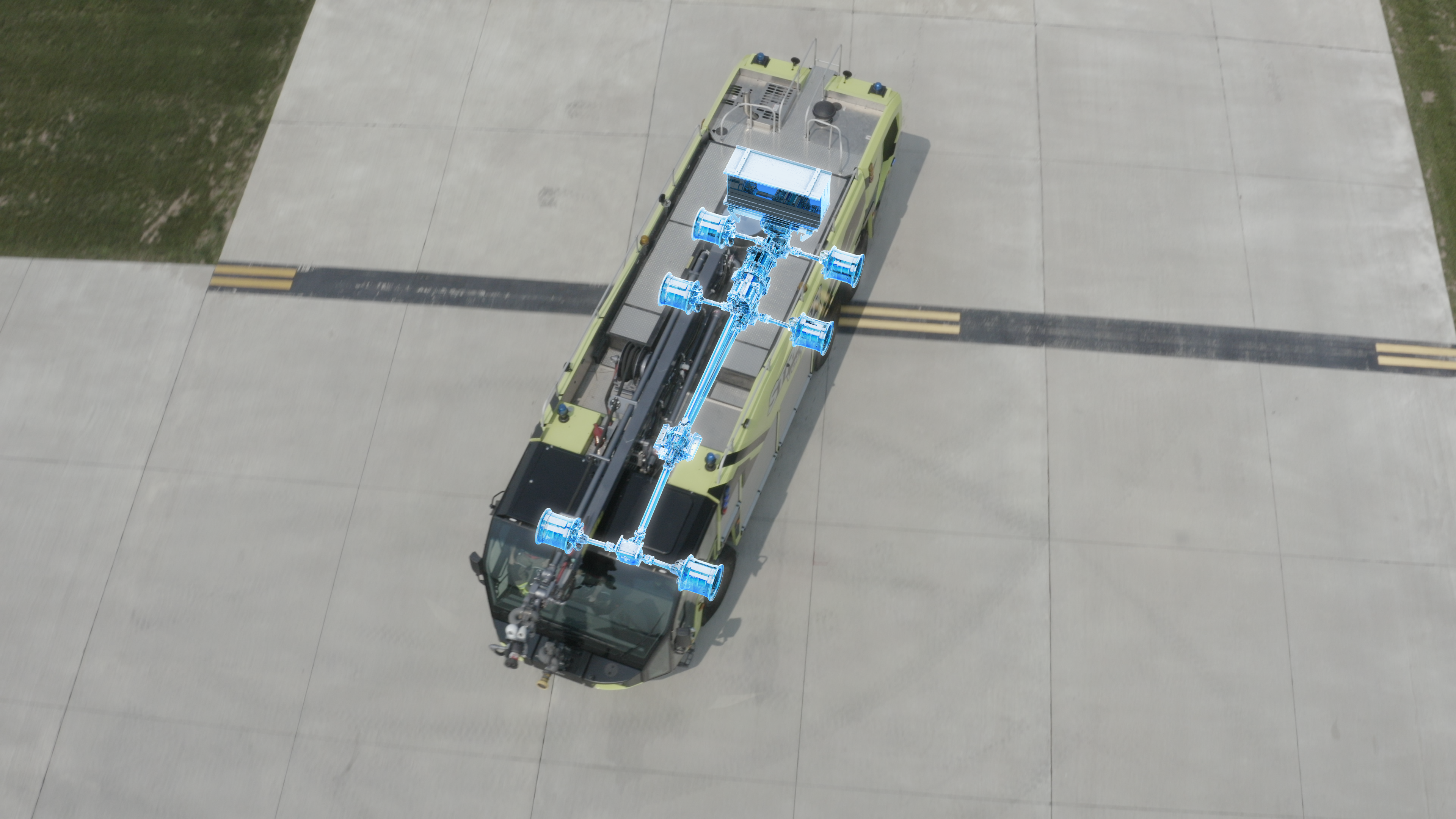 Striker Volterra electric ARFF driving outside on a sunny day with an EV Driving Mode Xray graphic. 