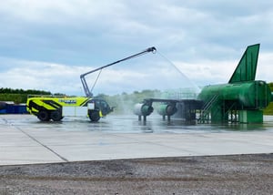 Striker Volterra Electric ARFF parked outside spraying water from the Snozzle.