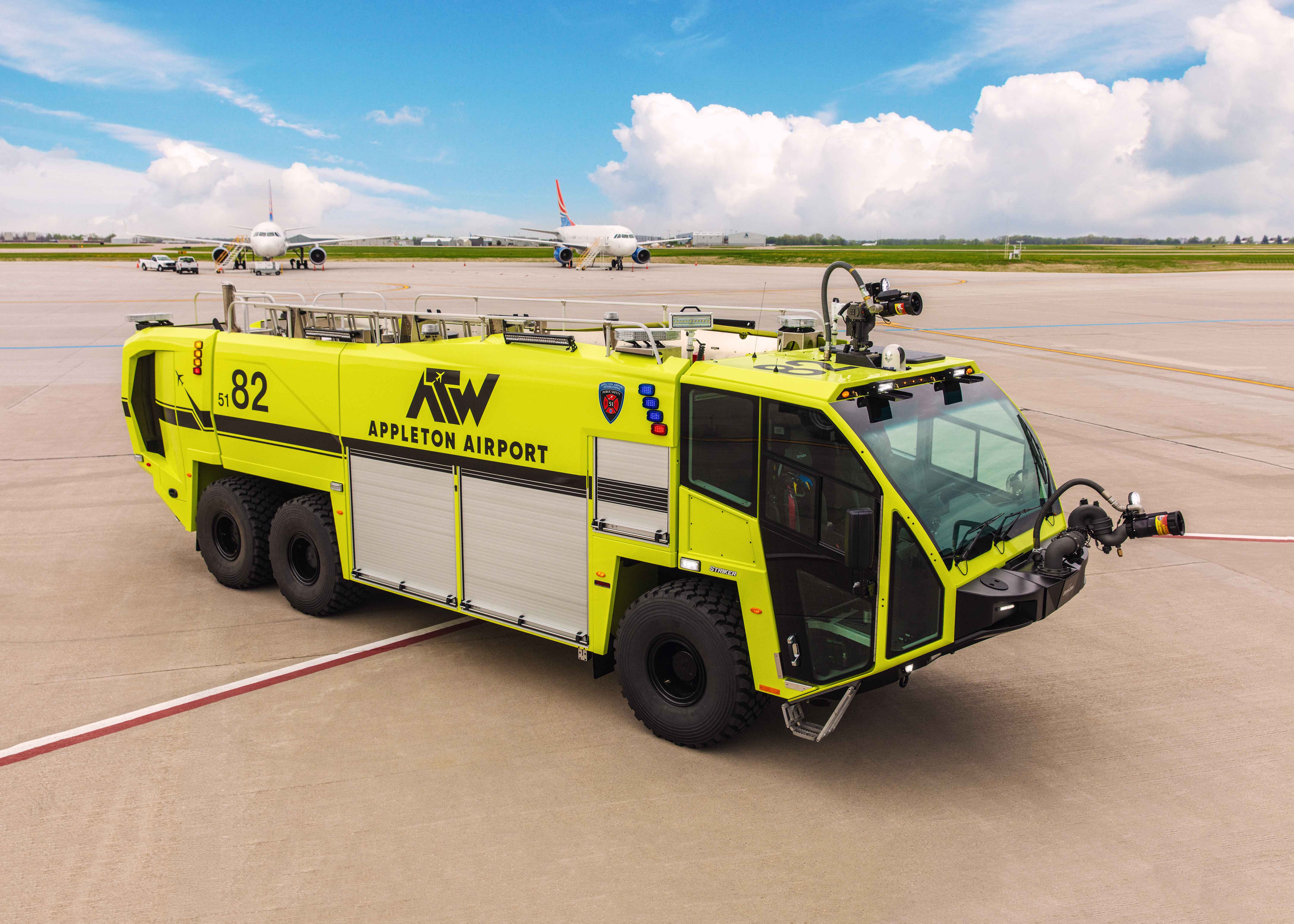 A Striker 6x6 ARFF for Appleton International Airport parked outside on a sunny day.
